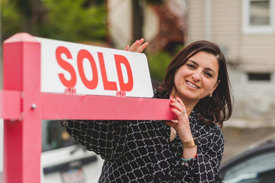 Home with solar panels sold sign.